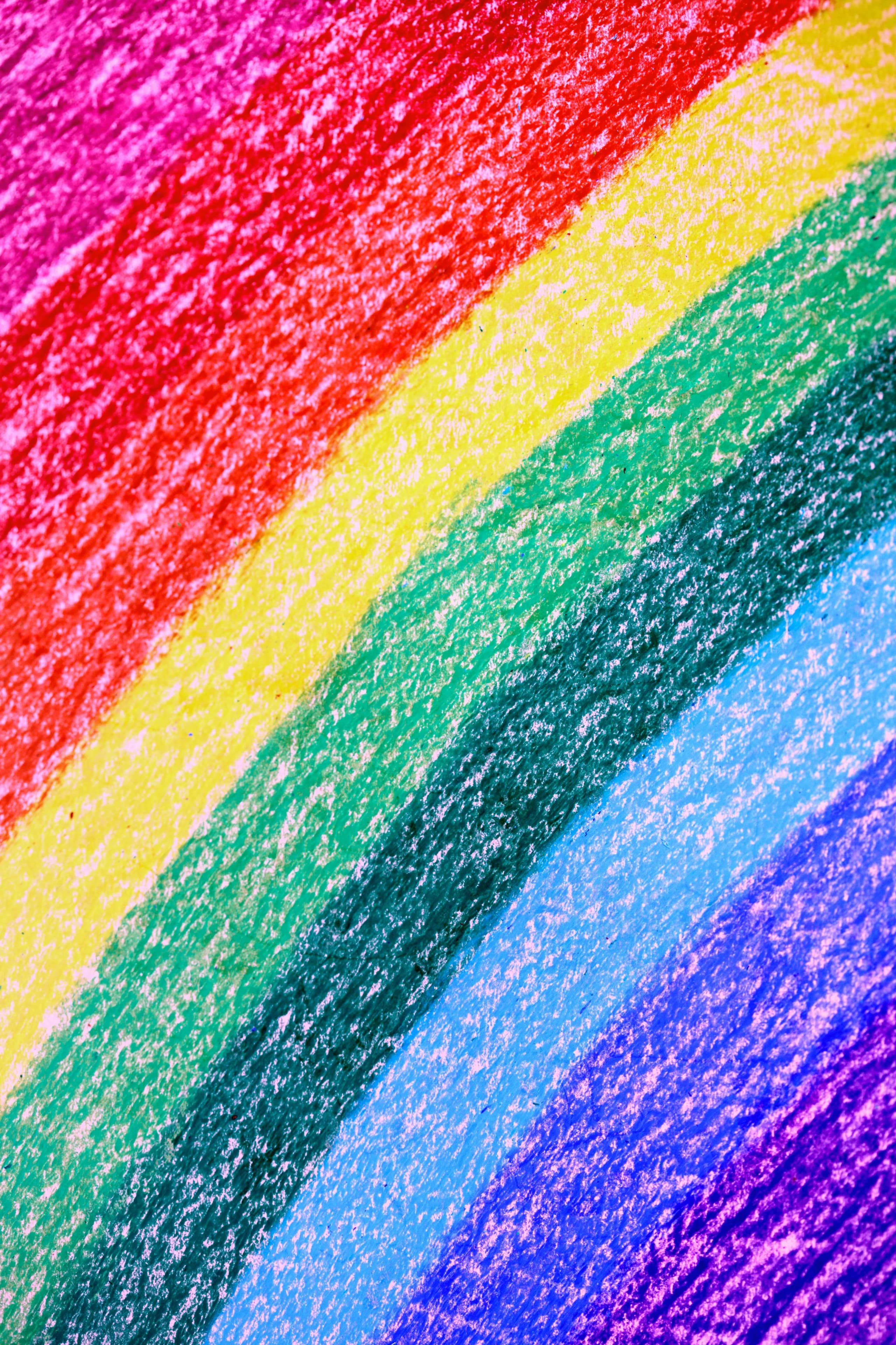 Vibrant rainbow crayon drawing showcasing colors and texture. Ideal for creative backgrounds.